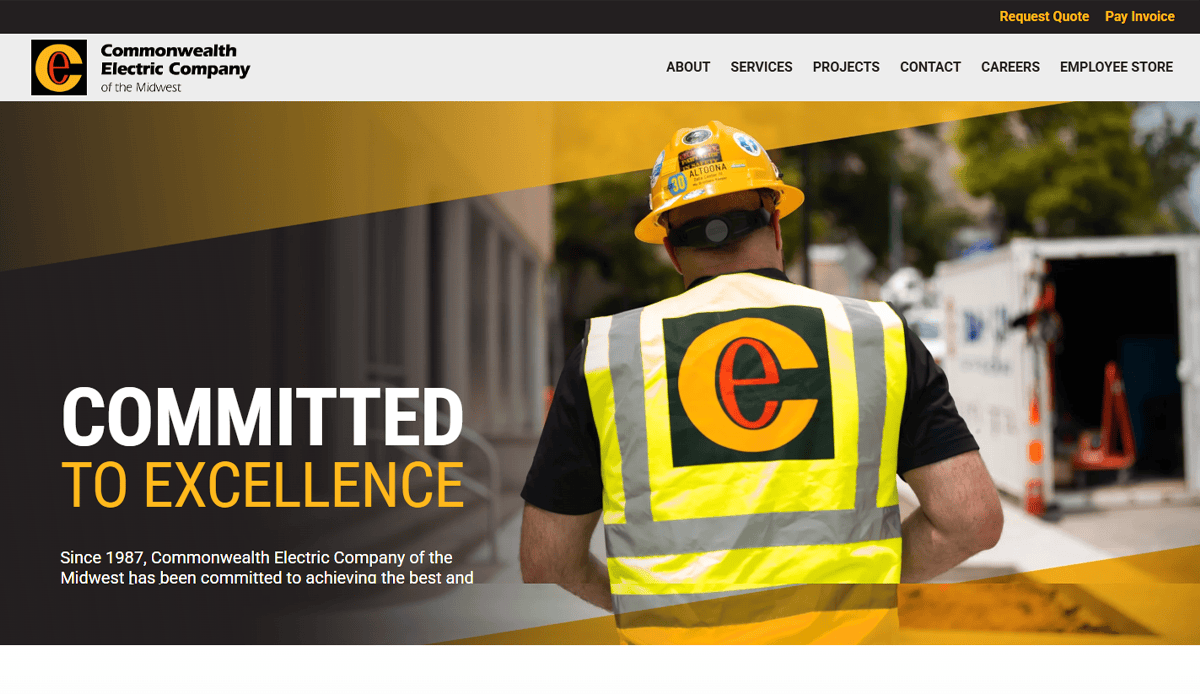A worker in a hard hat and reflective vest with a large orange C logo stands at a construction site; the text Committed to Excellence and Commonwealth Electric Company branding highlight their trusted commercial electrician services.