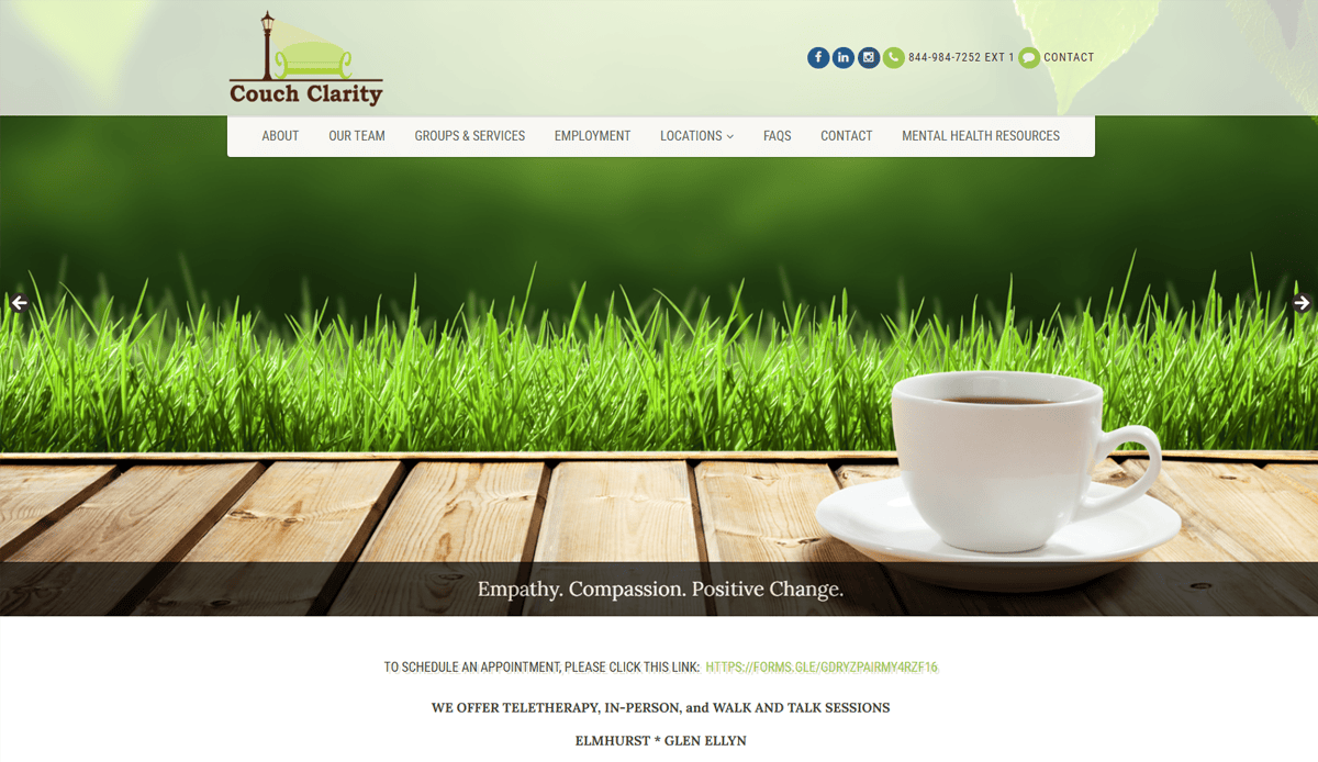 A white coffee cup and saucer sit on a wooden table outdoors with green grass and sunlight in the background. The website menu, featuring the Couch Clarity logo and contact info, highlights a client-centered practice site for psychotherapist website design.