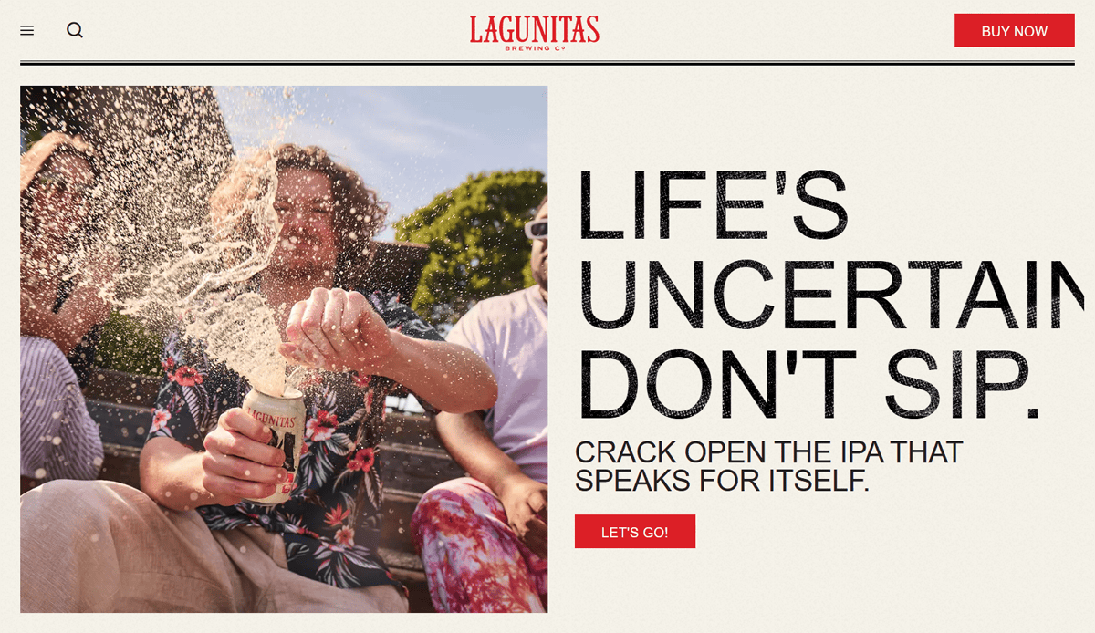 People sitting outside, laughing as an open Lagunitas beer can sprays foam. Large bold text reads: Life's uncertain. Don't sip. Crack open the IPA that speaks for itself—much like standout brewery website design. Red “LETS GO!” button is visible.