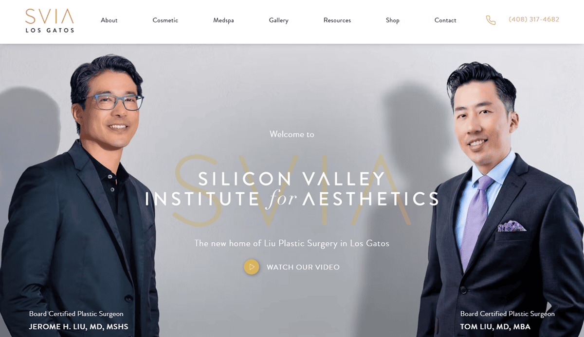 Two men in suits, both wearing glasses, stand on either side of a sign for the Silicon Valley Institute for Aesthetics, showcasing a cosmetic surgery website design that helps convert patients. Contact info is in the top right, with a menu along the top.