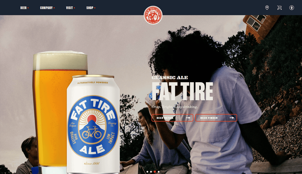 A can and glass of Fat Tire Ale are displayed on the left. In the background, people sit outside socializing, with trees and a building visible—a perfect scene to inspire modern Brewery Website Design. Text reads: “Classic Ale, Fat Tire. Crisp, bright, with subtle malt.”.