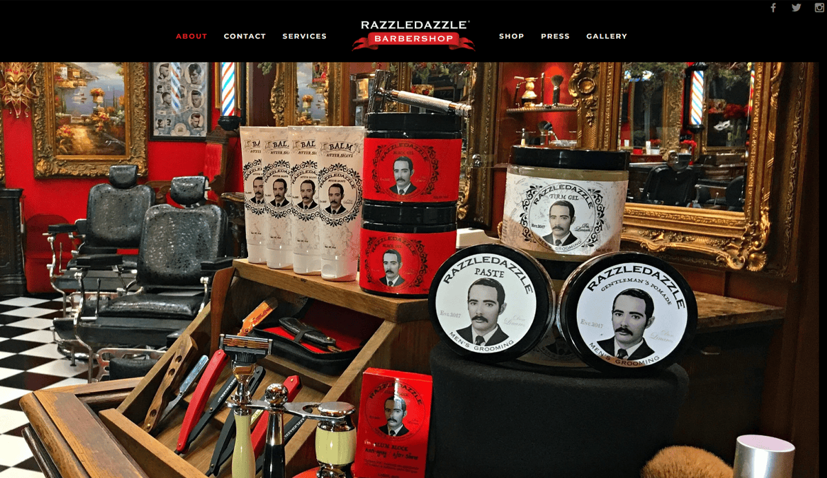 A barbershop interior with vintage decor, classic barber chairs, and grooming products displayed on the counter—perfect inspiration for a stylish Barber Shop Website featuring “RazzleDazzle” jars and vintage-style portrait labels.