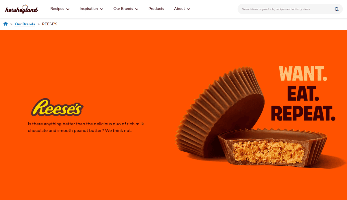 A Reese’s peanut butter cup, one whole and one cut in half showing the peanut butter filling, on an orange background with the text WANT. EAT. REPEAT., showcases delicious inspiration for any candy website design with the Reese’s logo.