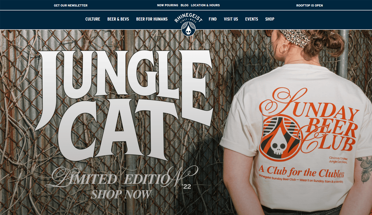 A person with a patterned headband and tattooed arm faces away, wearing a shirt that reads Sunday Beer Club next to large text, Jungle Cat Limited Edition Shop Now, showcasing design trends on the Rhinegeist brewery website.