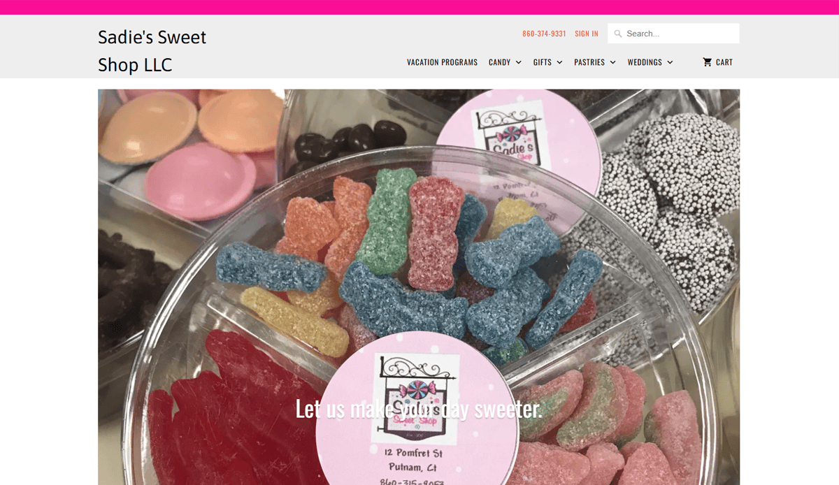 A Candy Website Design for Sadies Sweet Shop LLC showcases a round tray of assorted colorful candies with a pink label in the center. The header features navigation links and contact info, enhancing the shop’s inviting online presence.