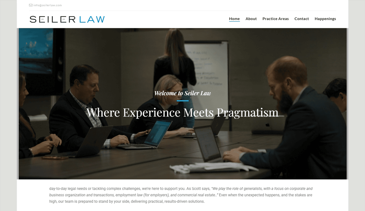 A group of professionals works on laptops around a conference table in a modern office, showcasing effective attorney website design. The website header reads “Seiler Law—Where Experience Meets Pragmatism.” A woman writes on a whiteboard in the background.