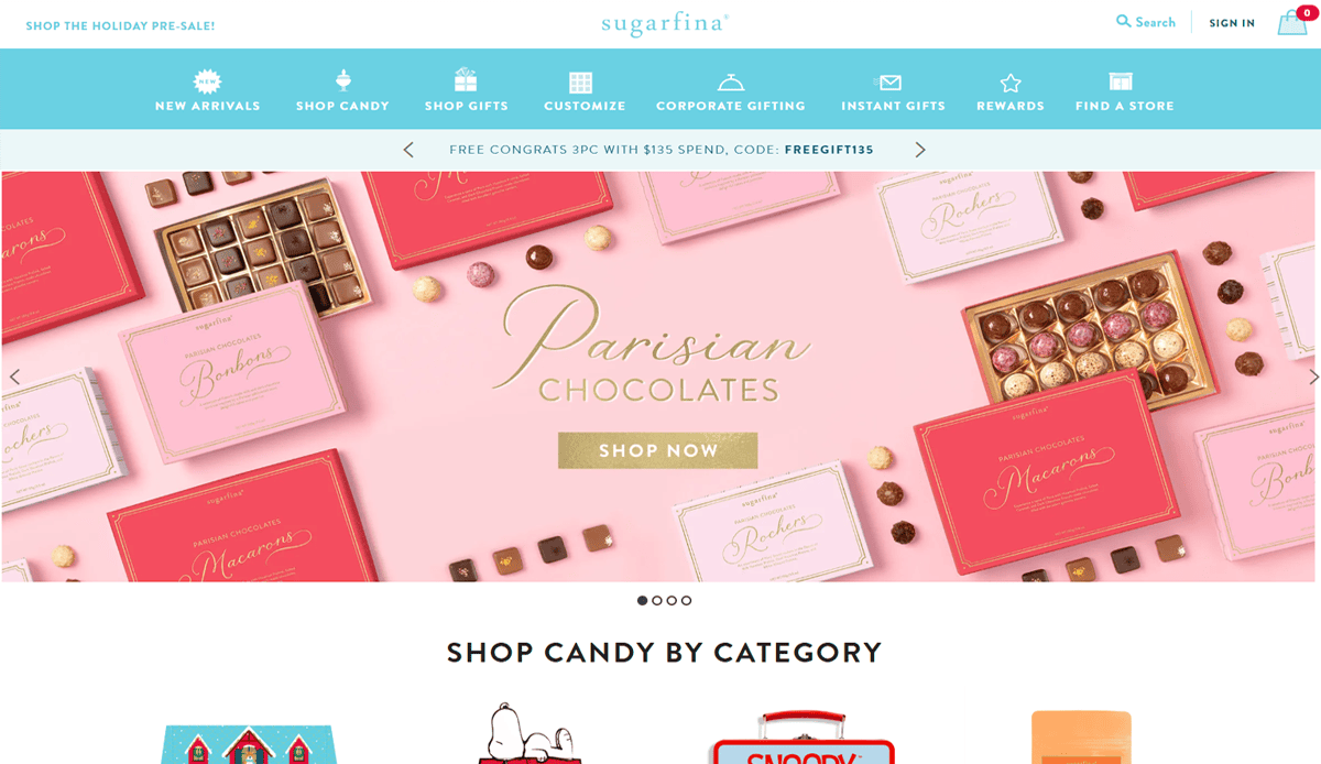 Screenshot of Sugarfina’s candy website design homepage featuring assorted pink and red boxes of Parisian chocolates, a “Shop Now” button, and navigation menus for new arrivals, shop gifts, and elevating your online presence.