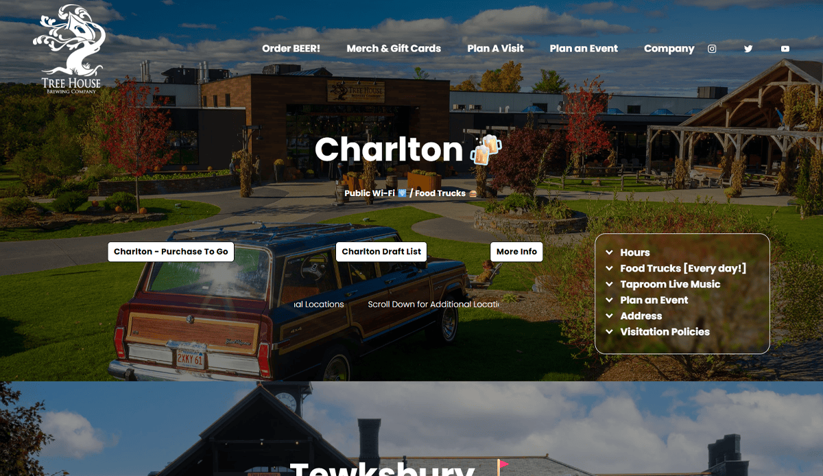 A brewery building with large windows sits behind a vintage woody station wagon on a lawn, surrounded by autumn trees under a partly cloudy sky. Modern brewery website features and menu options overlay the image.