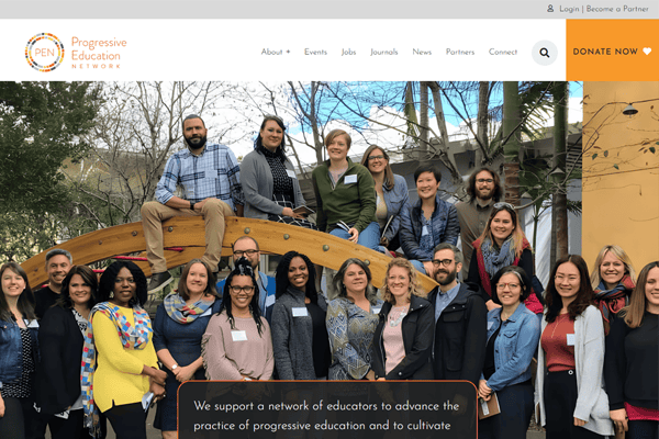 A diverse group of adults, smiling and posing together on and around a small wooden bridge, is pictured on the Progressive Education Networks website homepage. The site menu and a “DONATE NOW” button appear at the top.