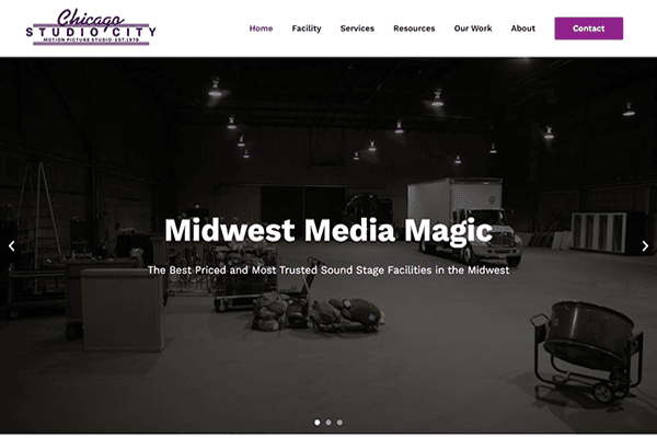 Large empty sound stage with lighting equipment, props, and carts scattered around. Website header reads Chicago Studio City with menu options and a Contact button. Text overlay says Midwest Media Magic..